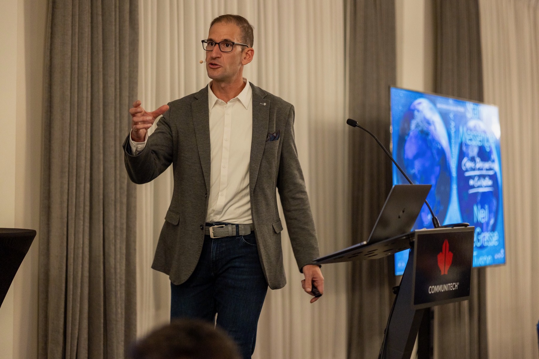 Ramy Nassar delivering a keynote on stage